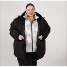 Woman in black winter coat from women’s plus size 1X-6X winter down alternative 3-in-1 jacket