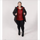 Woman in black coat and red vest wearing winter down alternative 3-in-1 jacket