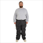 Man wearing gray long-sleeve shirt and dark snow pants from Snow Country Outerwear for skiing