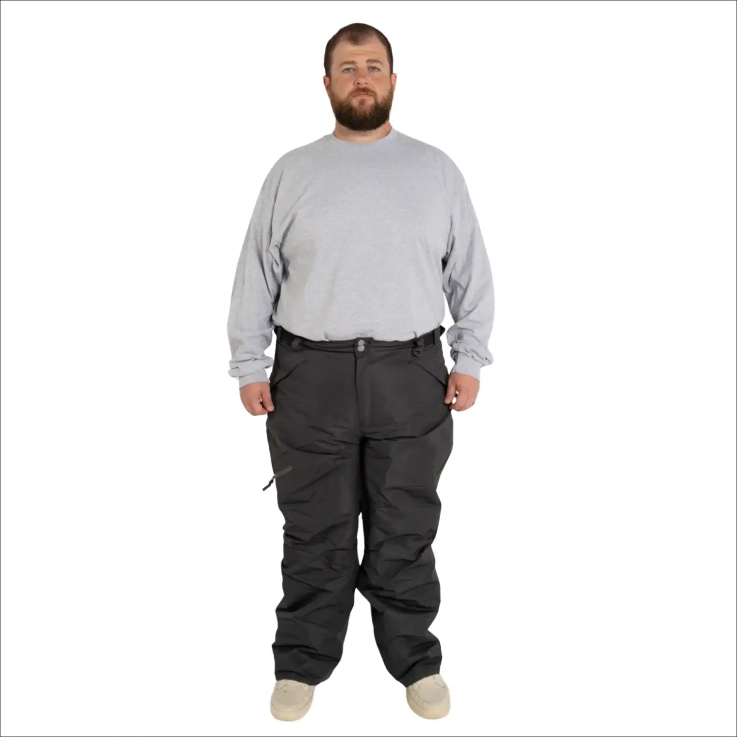 Man wearing gray long-sleeve shirt and dark snow pants from Snow Country Outerwear for skiing
