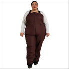 Woman wearing brown insulated bib overalls from Snow Country Outerwear for skiing
