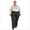 Woman wearing black Snow Country insulated plus size ski pants in a snowy mountain setting