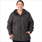 Woman wearing a plus size printed waterproof hooded rain jacket for wind protection