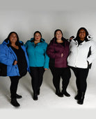 Four plus-size women wearing colorful Snow Country Outerwear Aspen Ski Jackets