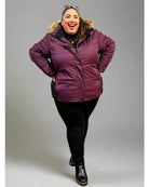 Woman wearing Maroon Snow Country Outerwear Womens Aspen Ski Jacket Coat outdoors