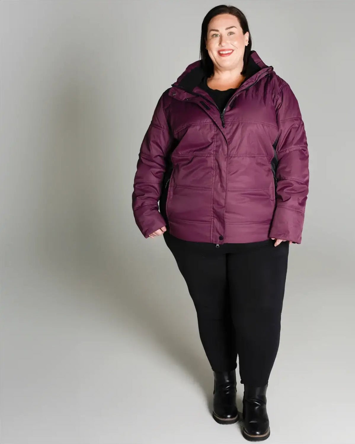 Plum-colored puffer jacket from Snow Country Outerwear Women’s Aspen Ski Coat collection