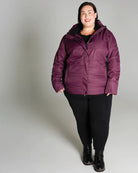 Plum-colored puffer jacket from Snow Country Outerwear Women’s Aspen Ski Coat collection