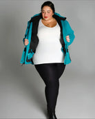 Woman wearing a teal Snow Country Outerwear Womens Aspen Ski Jacket Coat