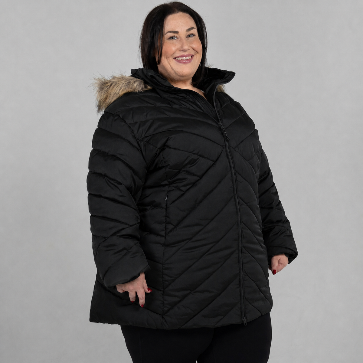 Black Axtell plus size parka, sizes 1X to 6X, front angle on model