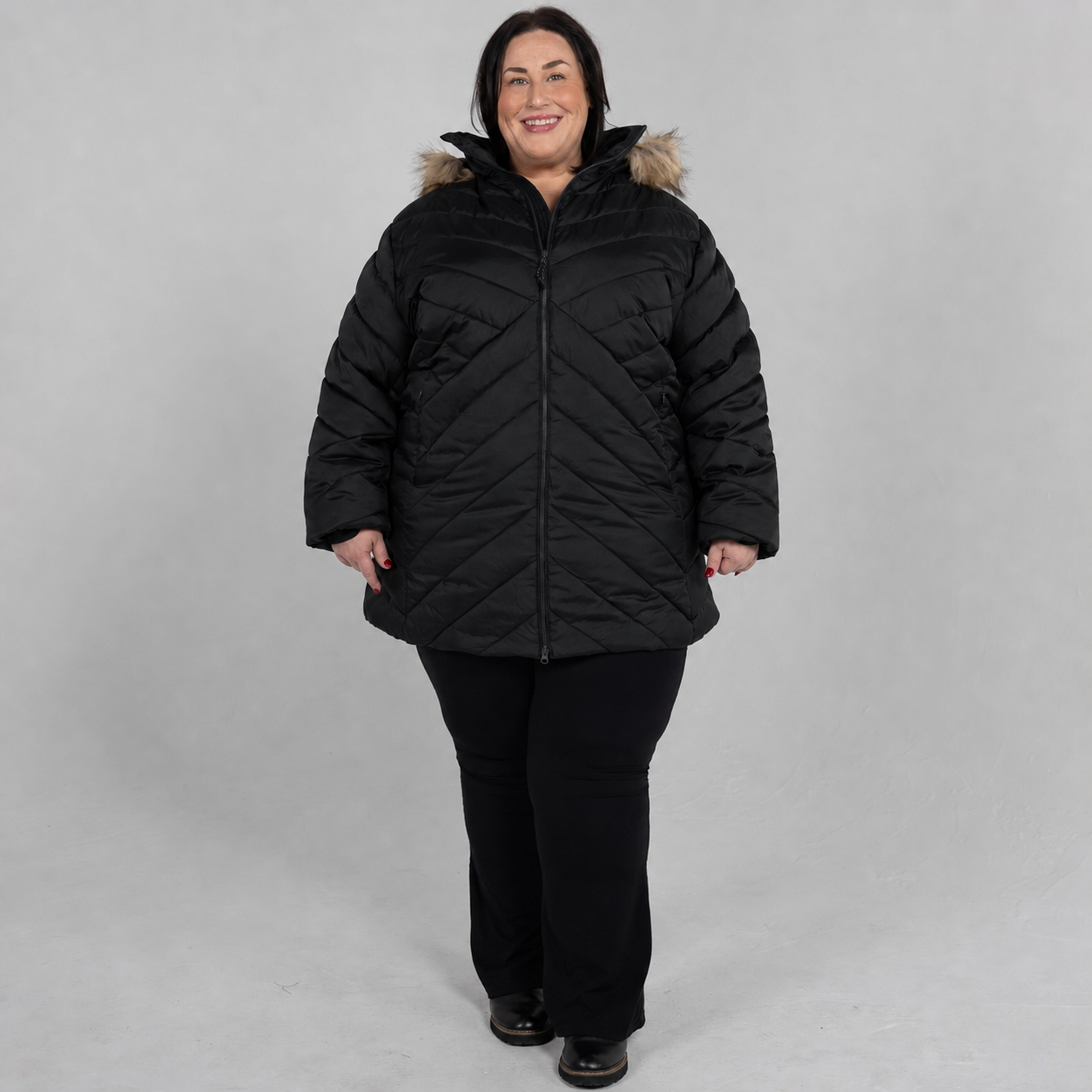 Black Axtell plus size parka, sizes 1X to 6X, front view on model