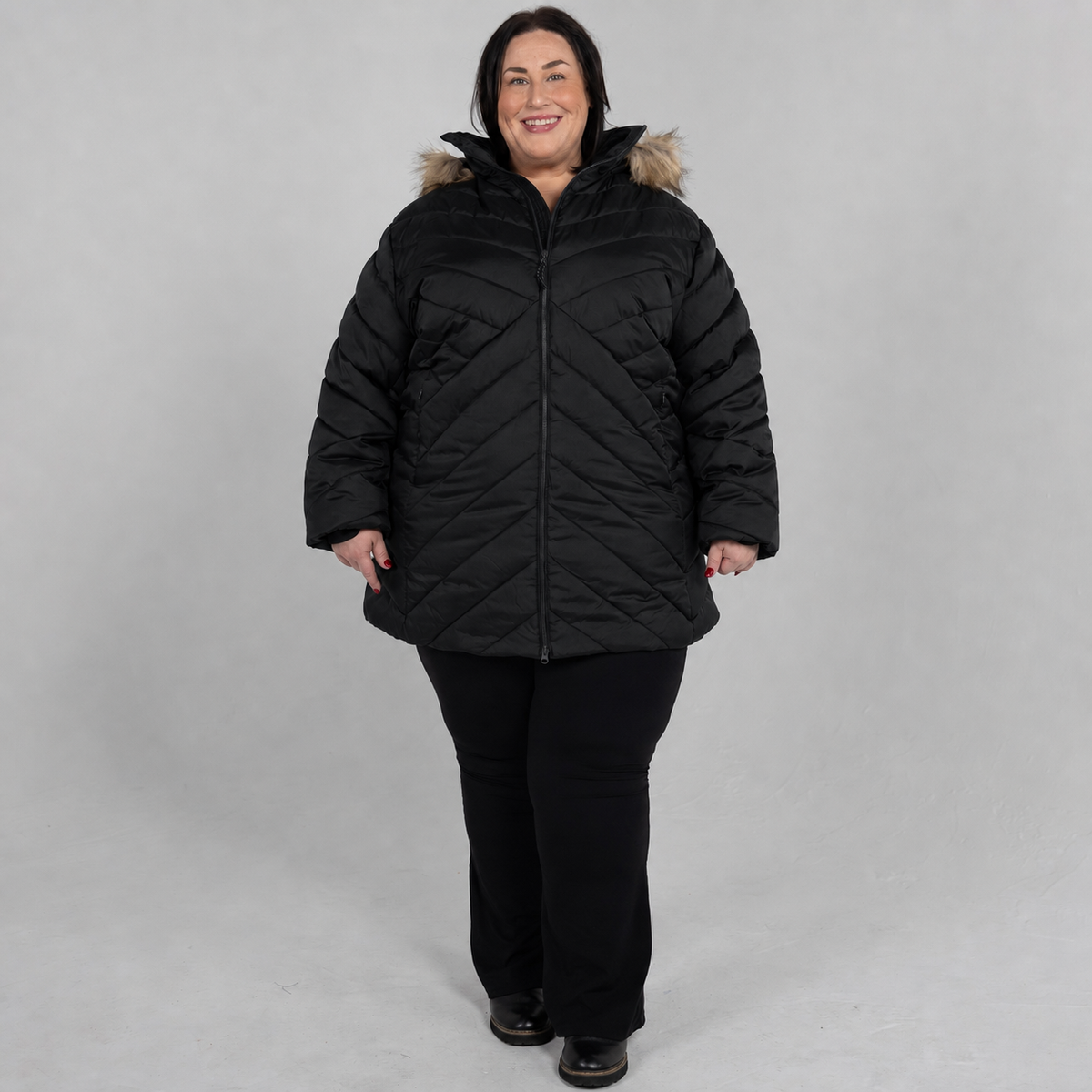 Black Axtell plus size parka, sizes 1X to 6X, front view on model