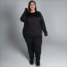 Black long-sleeved athletic base layer set for Women from Snow Country Outerwear