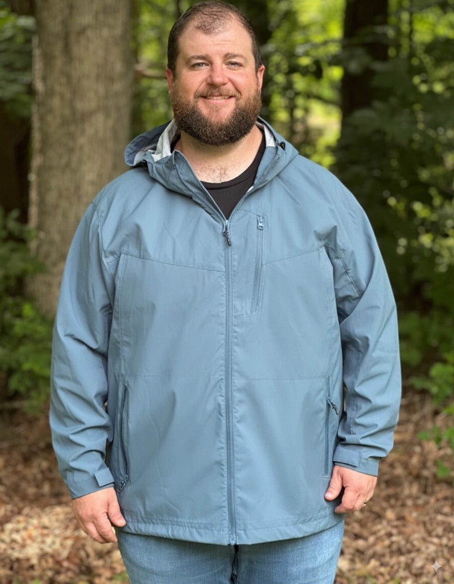 big and tall man in a big and tall rain jacket in the outdoors