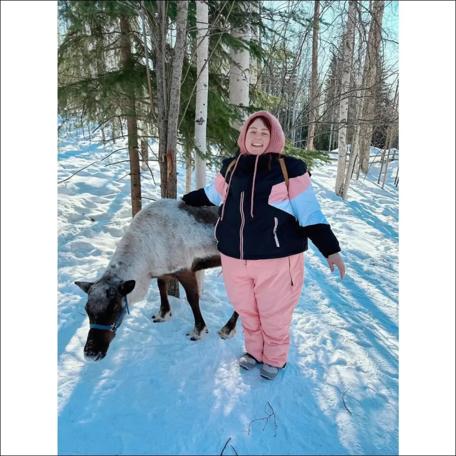Woman with reindeer in snowy landscape wearing Snow Country Plus Size Ski Jacket