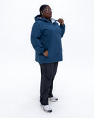 Plus size 804 rain jacket teal 3 | Model is 5'9" and wears a 3X