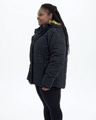 Black women's plus size Aspen ski jacket, side | Model is 5'6" and wears a 1X