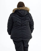 Black The Axtell plus size hooded winter parka, back | Model is 5'4" and wears a 3X