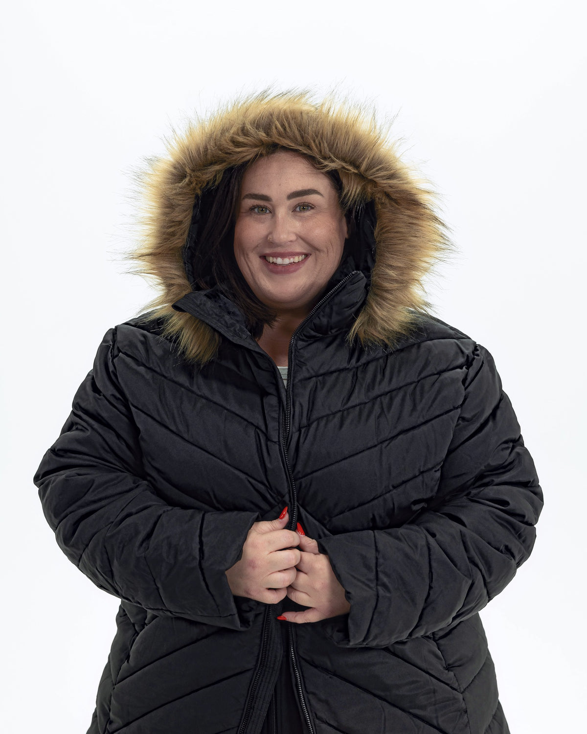 Black The Axtell plus size hooded winter parka, hood up with faux fur trim | Model is 5'4" and wears a 3X
