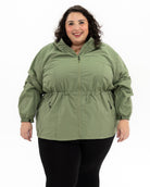 Plus size mystique rain jacket sage 1 | Model is 5'3" and wears a 5X