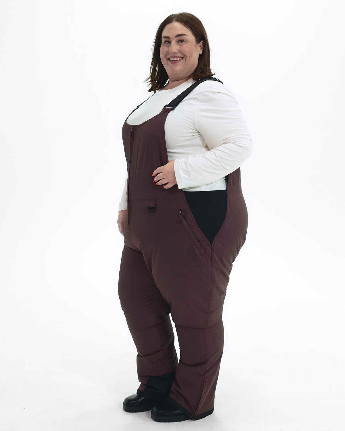 Eggplant women's plus size Overland snow bibs, front angle | Model is 5'4" and wears a 3X
