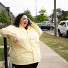 Plus size pod rain jacket lifestyle 2 all-groups | Model is 5'3" and wears a 5X