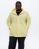 Plus size pod rain jacket yellow 1 | Model is 5'9" and wears a 3X