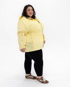 Plus size pod rain jacket yellow 9 | Model is 5'3" and wears a 5X