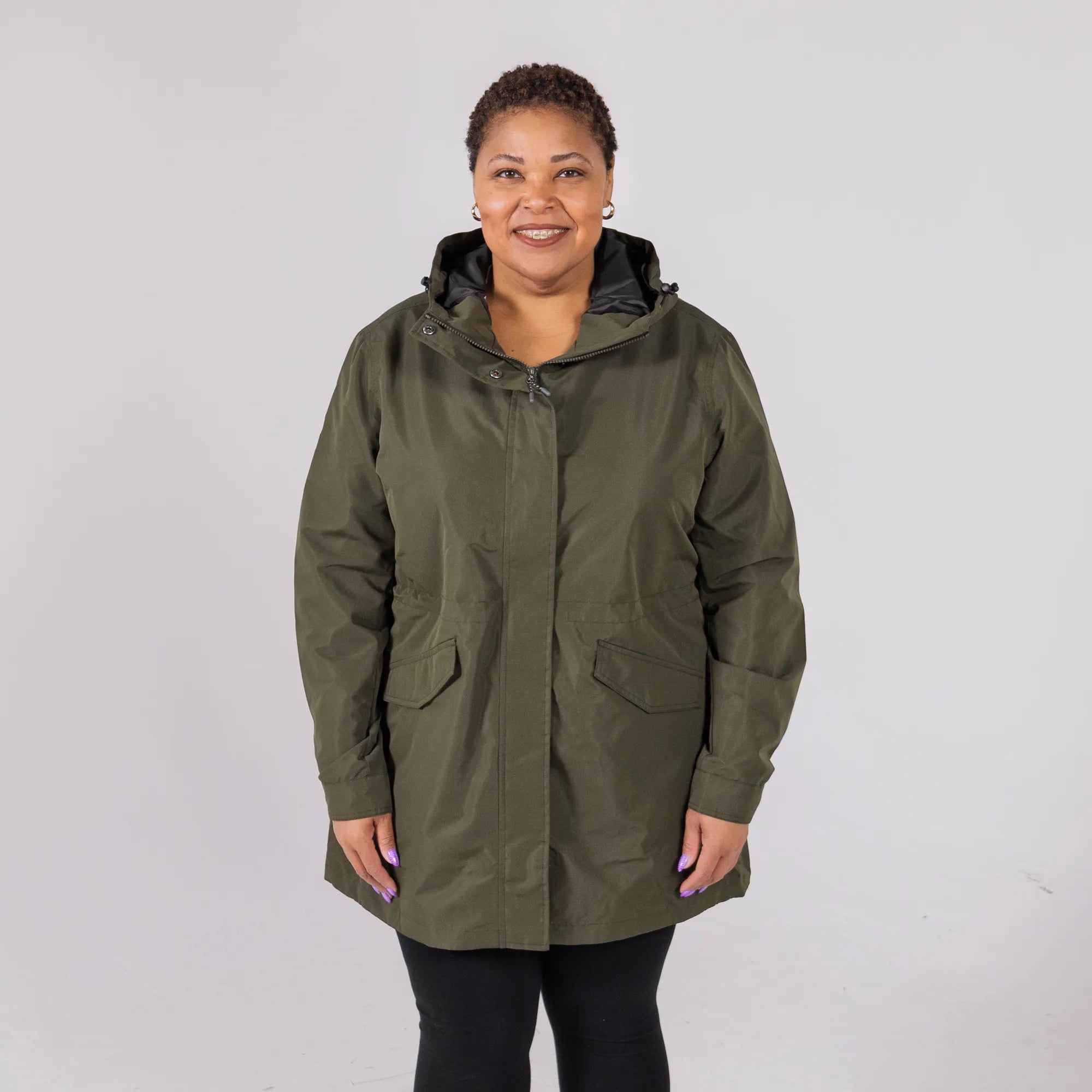 plus size woman wearing plus size rain jacket in green
