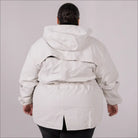 Beige plus size rain jacket on model, back image