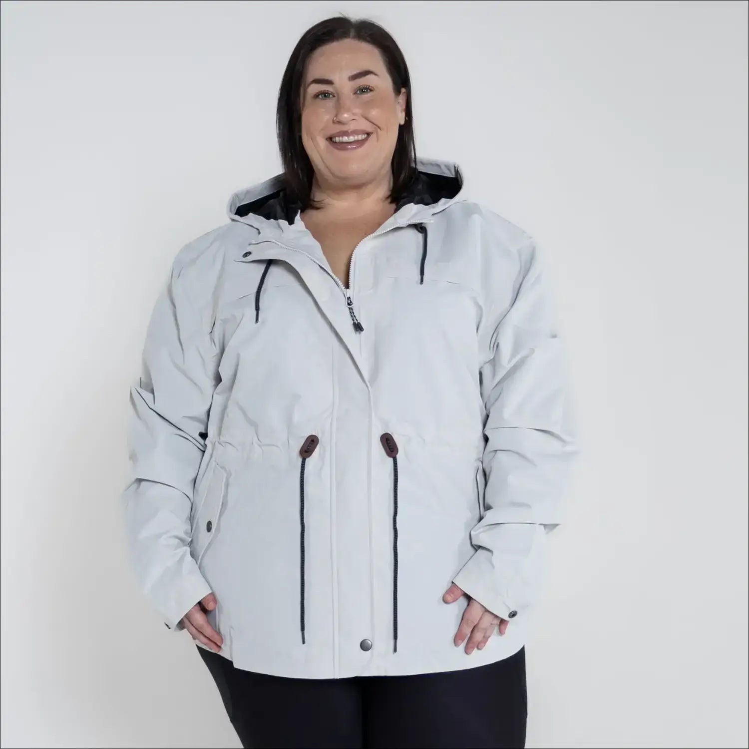 Beige plus size rain jacket on model, front image