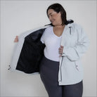 Woman wearing Light Gray Rain Jacket with Black Lining from The Manchester plus size collection