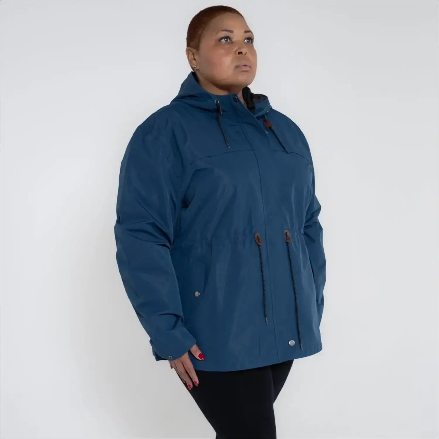 Blue plus size rain jacket on model, side image
