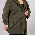Green plus size rain jacket on model, side image