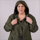 Blue plus size rain jacket on model, front image with hood up