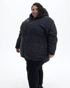 Black The Savvy II plus size quilted jacket, front three quarter | Model is 5'4" and wears a 5X