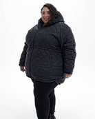 Black The Savvy II plus size quilted jacket, side | Model is 5'4" and wears a 5X