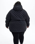 Black The Savvy II plus size quilted jacket, back | Model is 5'4" and wears a 5X