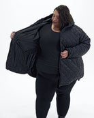 Black The Savvy II plus size quilted jacket, worn open showing the lining | Model is 5'4" and wears a 5X