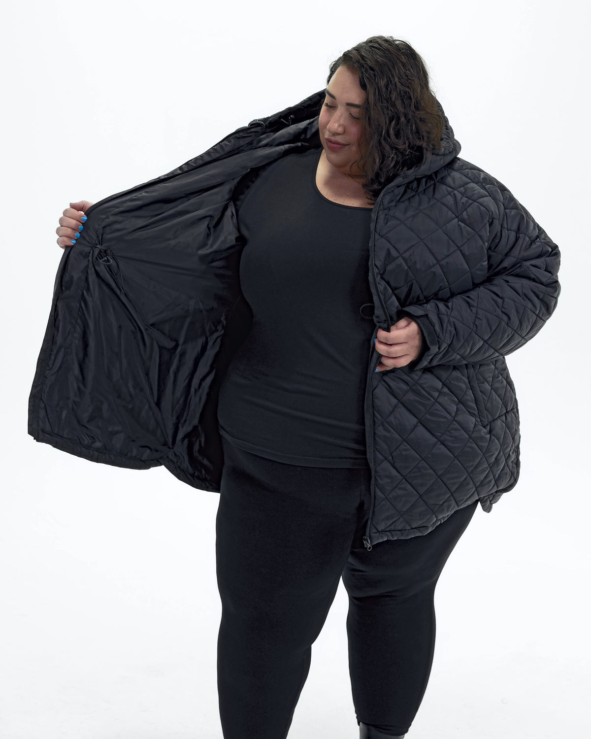 Black The Savvy II plus size quilted jacket, worn open, side | Model is 5'4" and wears a 5X
