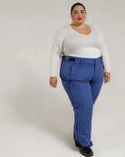 Woman wearing blue Snow Country insulated plus size ski pants for women