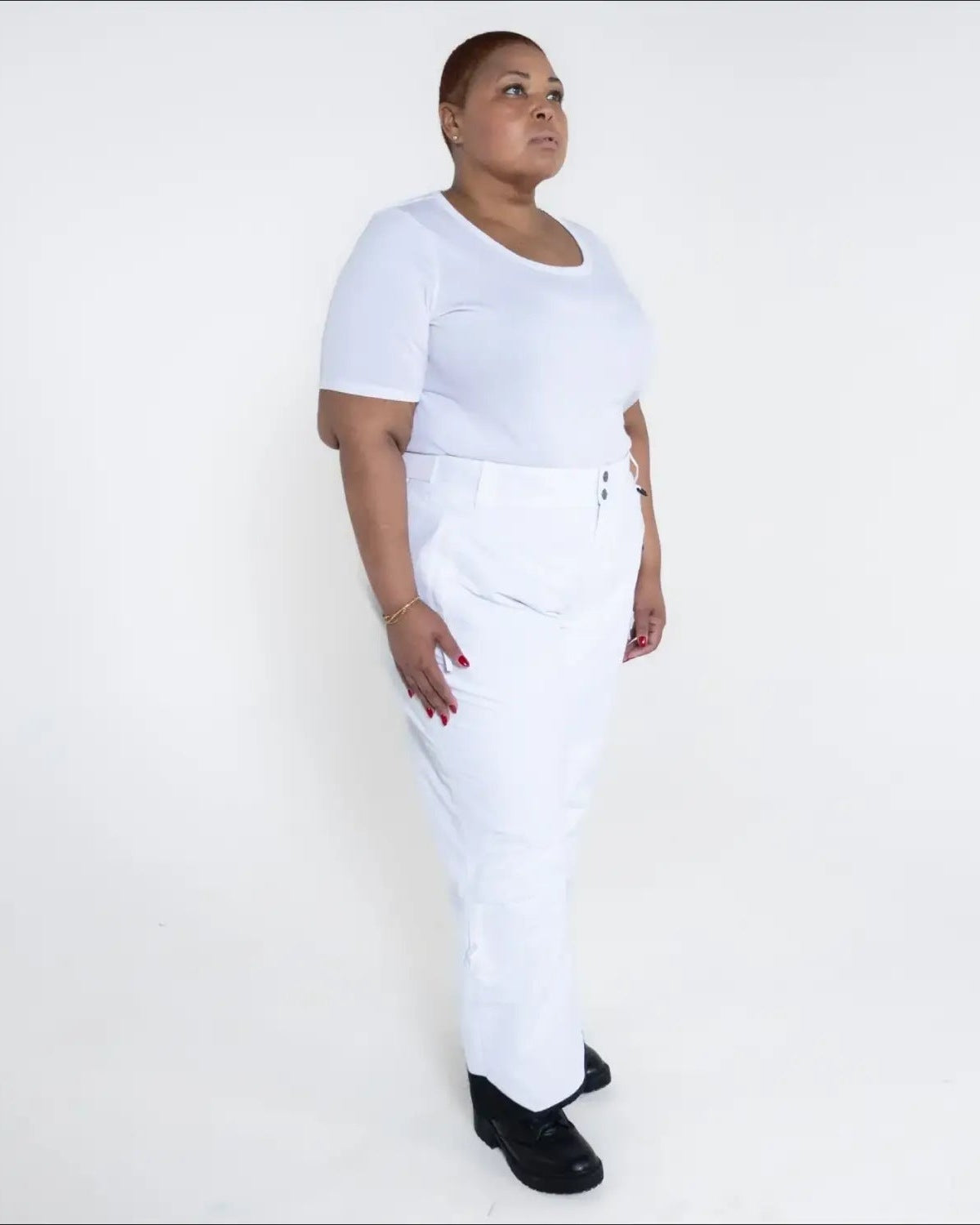 Woman in white outfit wearing Snow Country Plus Size Insulated Ski Pants