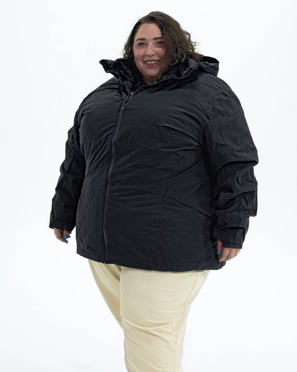 Black The Tempest plus size insulated snow jacket, front | Model is 5'4" and wears a 5X