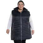 Woman wearing a black quilted insulated vest from Pristine Plus Size Outerwear collection
