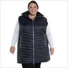 Woman wearing a black quilted insulated vest from Pristine Plus Size Outerwear collection