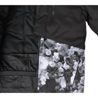 Black floral Snow Country Outerwear girls winter ski jacket with peony design